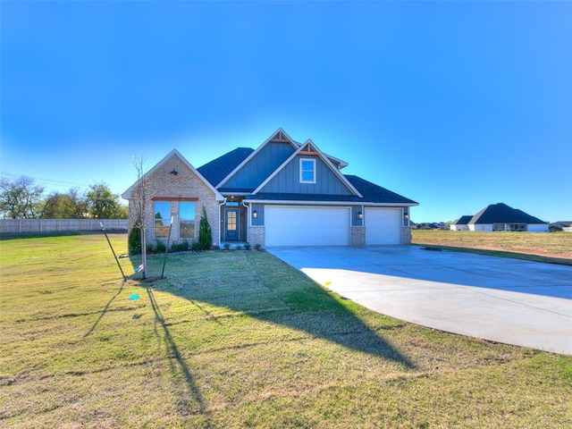 craftsman-style home featuring a front yard and a garage