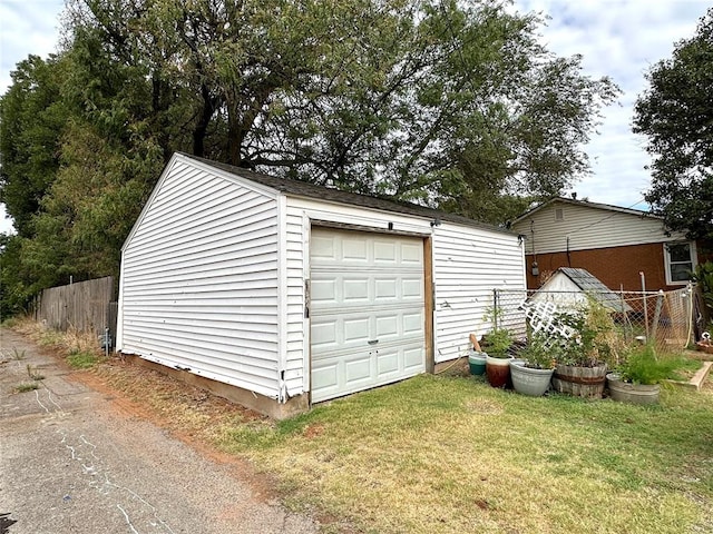 garage featuring a lawn