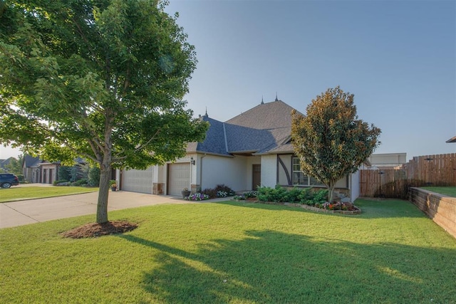 single story home featuring a front yard and a garage