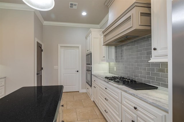 kitchen with custom exhaust hood, crown molding, decorative backsplash, light tile patterned floors, and stainless steel appliances