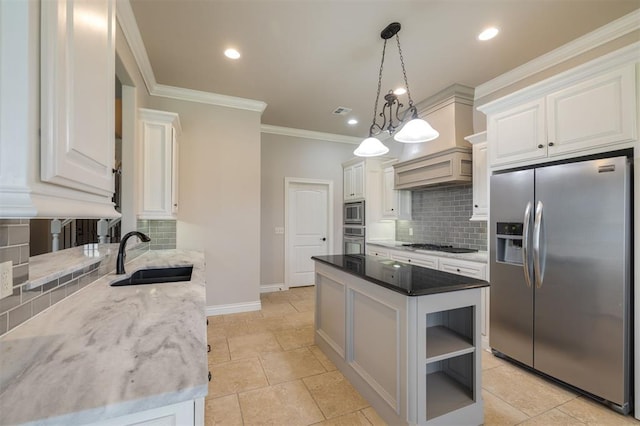 kitchen featuring dark stone countertops, white cabinetry, sink, and appliances with stainless steel finishes