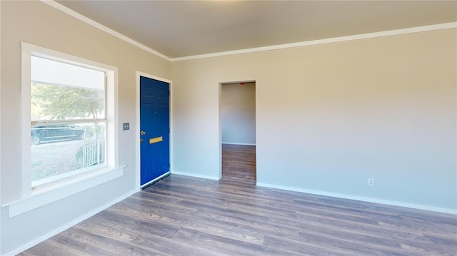 unfurnished room with dark hardwood / wood-style flooring and crown molding