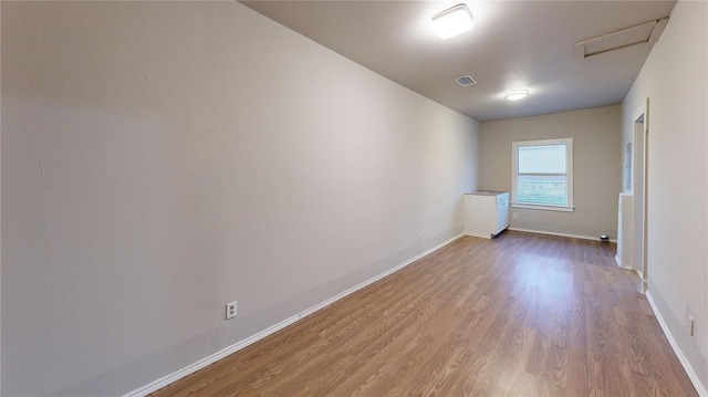 spare room with light hardwood / wood-style flooring