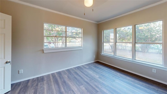 empty room featuring ceiling fan, dark hardwood / wood-style floors, and ornamental molding