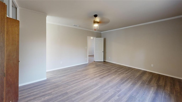 empty room with dark hardwood / wood-style flooring, ceiling fan, and crown molding