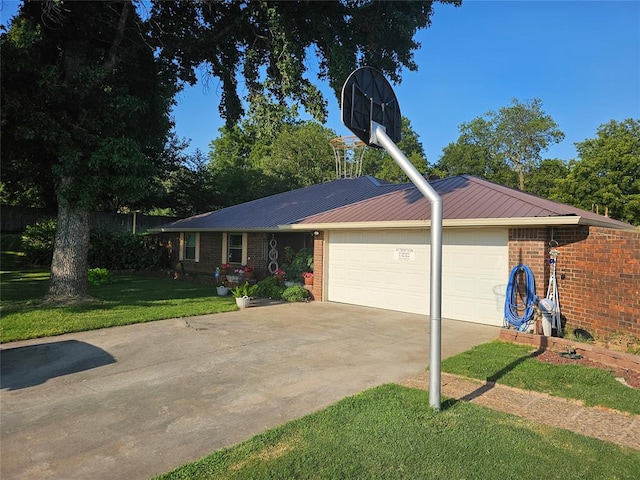 single story home with a garage and a front lawn