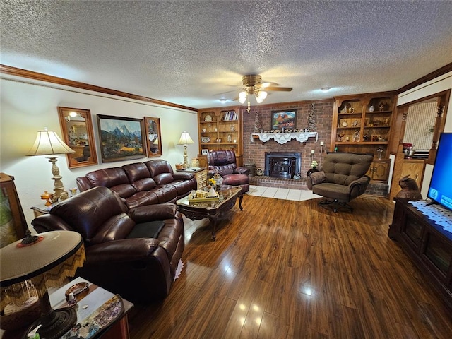 living room featuring a fireplace, ceiling fan, dark hardwood / wood-style flooring, and a textured ceiling