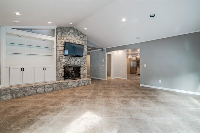 unfurnished living room featuring a stone fireplace and vaulted ceiling