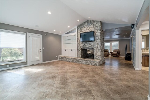 unfurnished living room with a fireplace and vaulted ceiling