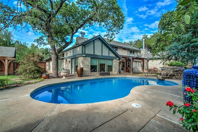 view of pool with a patio area