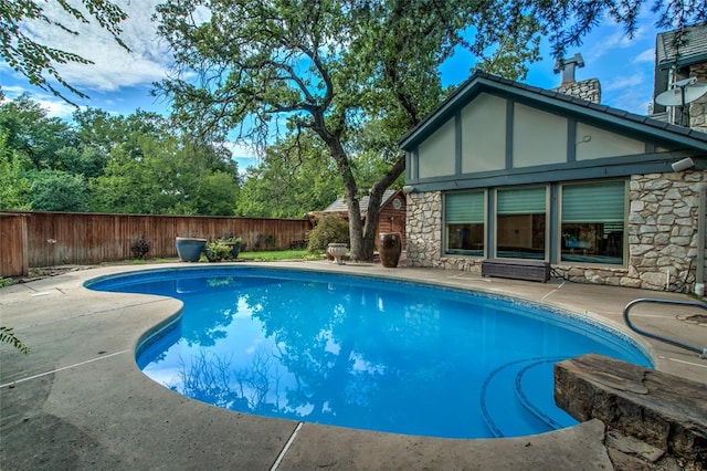 view of pool featuring a patio