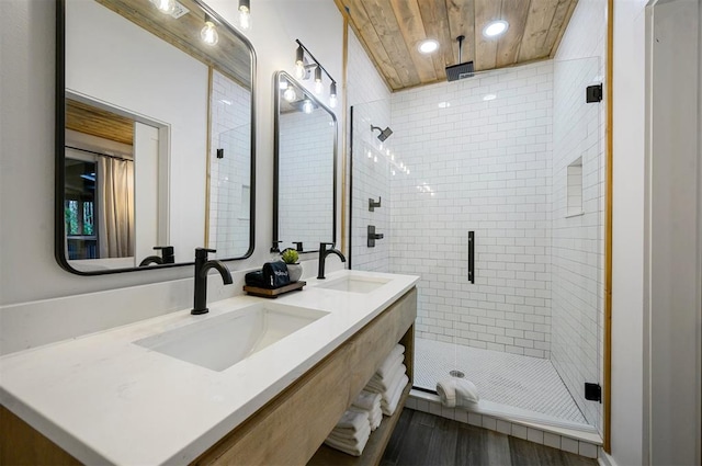 bathroom featuring walk in shower, vanity, and hardwood / wood-style flooring