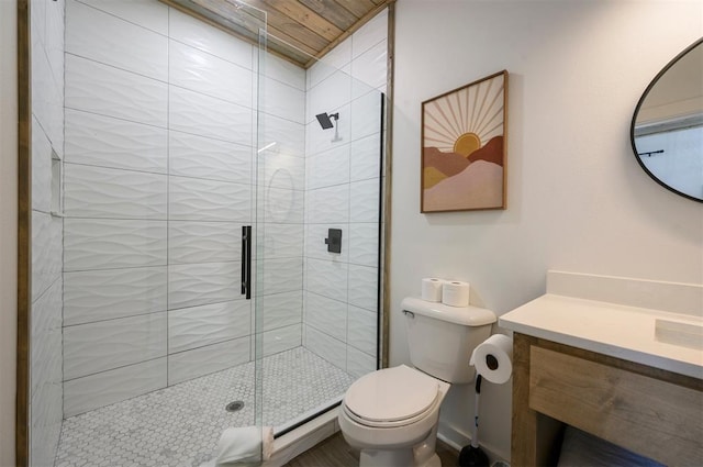 bathroom featuring vanity, toilet, a shower with door, and wood ceiling