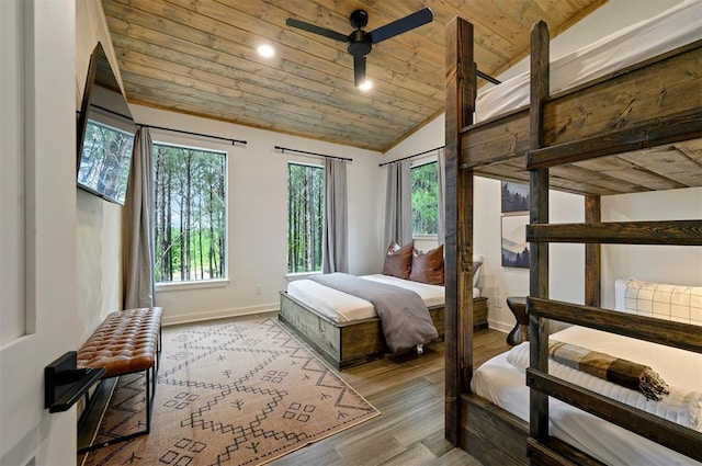 bedroom featuring ceiling fan, vaulted ceiling, wood ceiling, and light hardwood / wood-style flooring