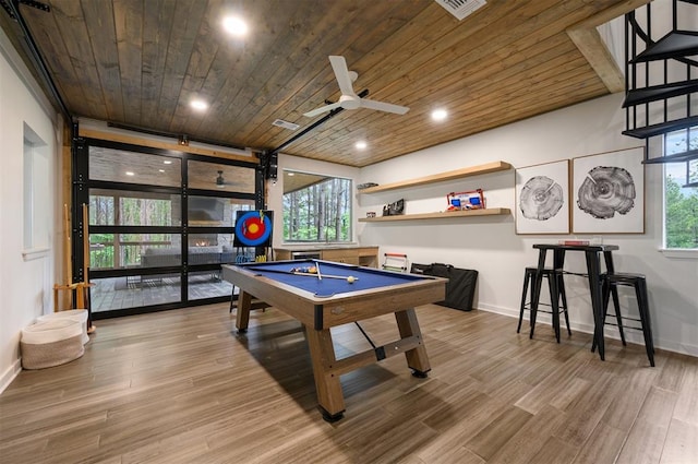 rec room with wood-type flooring, plenty of natural light, wooden ceiling, and ceiling fan