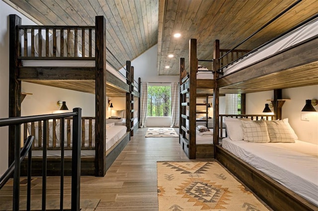 bedroom with hardwood / wood-style floors, wood ceiling, and lofted ceiling