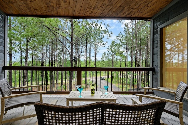 sunroom with wooden ceiling