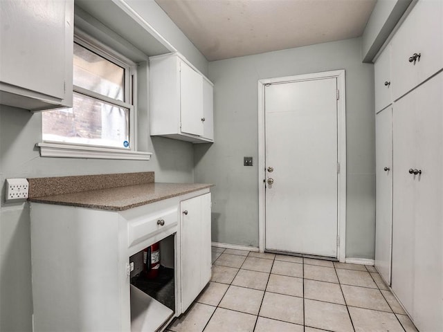 washroom featuring light tile patterned flooring