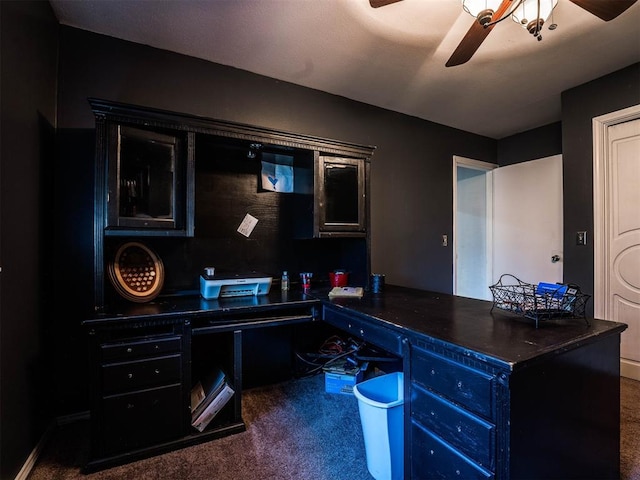 carpeted home office with ceiling fan