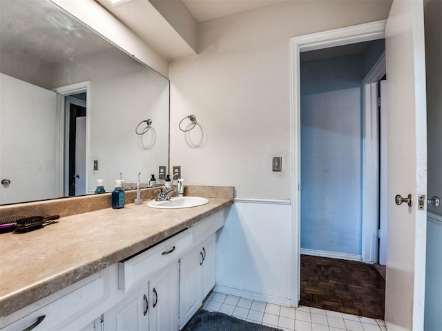 bathroom with vanity and parquet floors