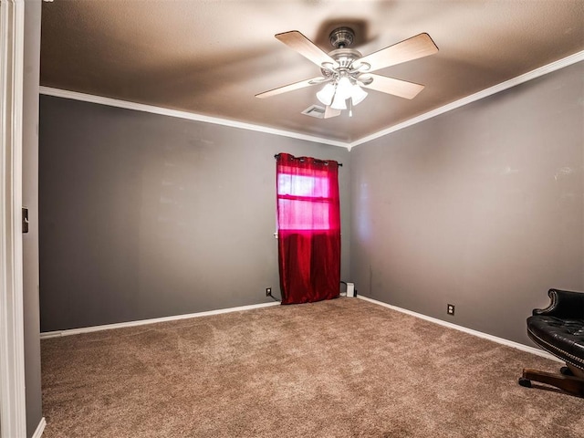 spare room with carpet flooring, ceiling fan, and ornamental molding