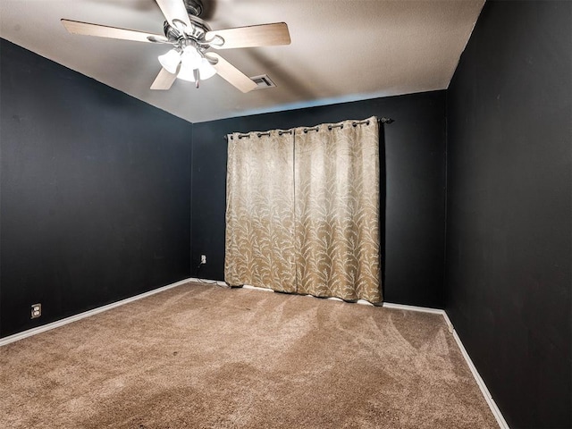 carpeted empty room with ceiling fan