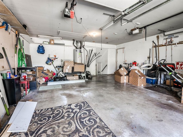 garage with gas water heater and a garage door opener