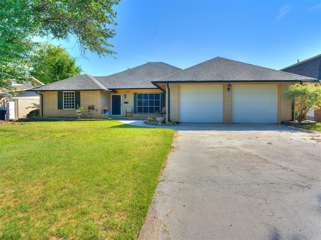 ranch-style home featuring a front yard and a garage