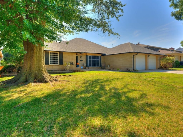 ranch-style home with a front lawn and a garage