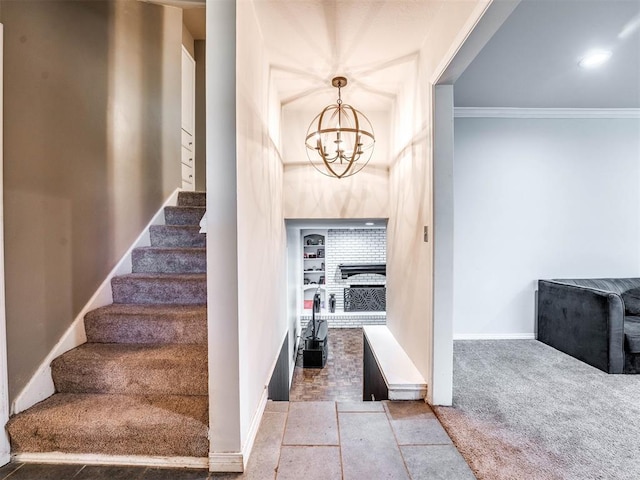 interior space with carpet flooring, an inviting chandelier, and crown molding