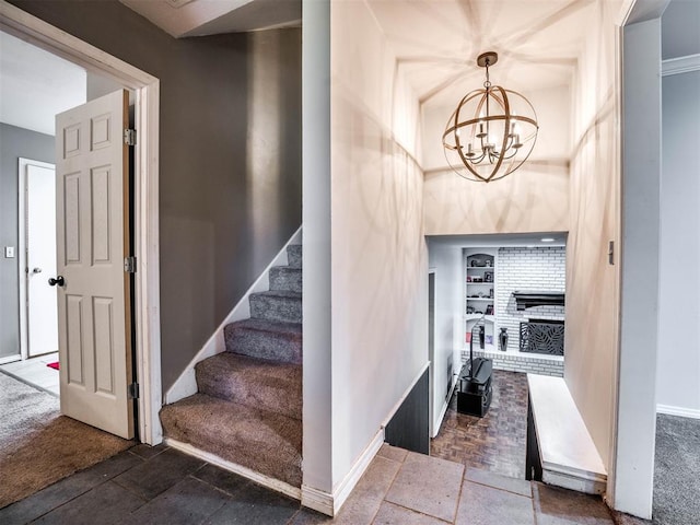 staircase featuring carpet floors and an inviting chandelier