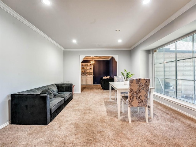 living room with light carpet, crown molding, and a healthy amount of sunlight