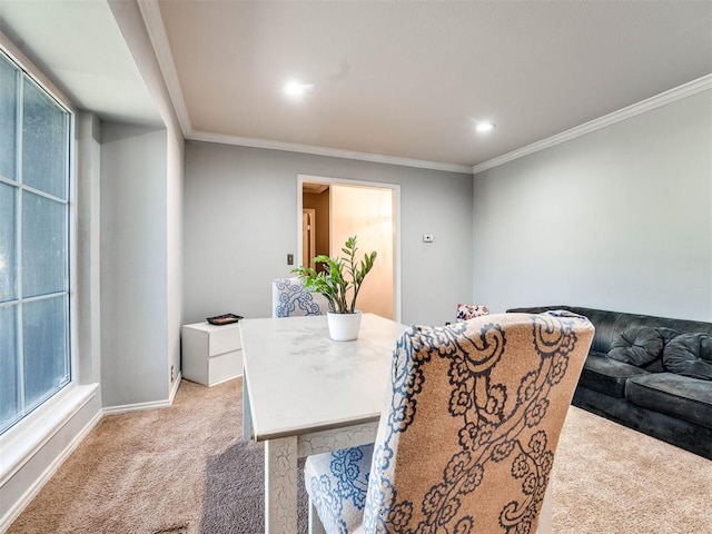 carpeted dining area featuring crown molding