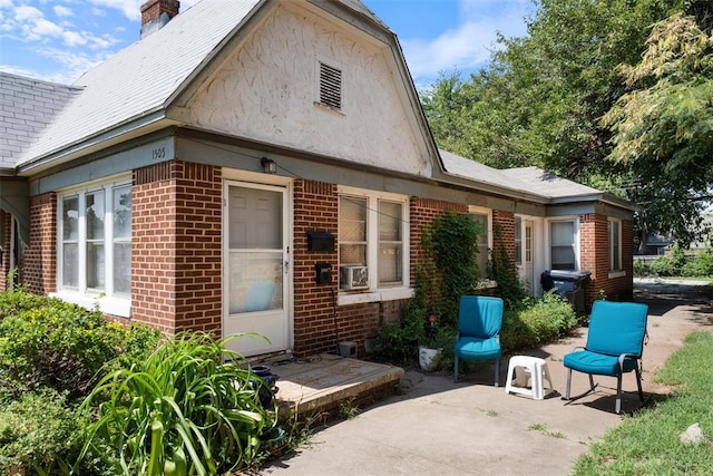 rear view of house featuring a patio