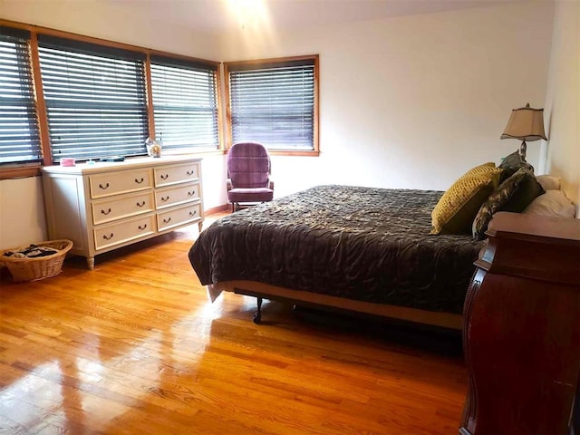 bedroom with light hardwood / wood-style flooring