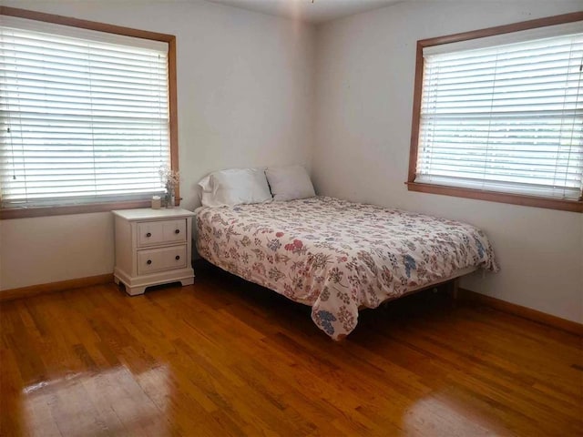 bedroom featuring light wood-type flooring and multiple windows