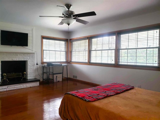 bedroom featuring hardwood / wood-style floors and ceiling fan