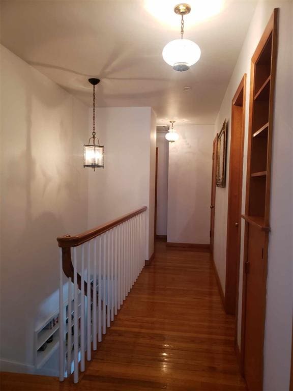 corridor featuring dark hardwood / wood-style flooring