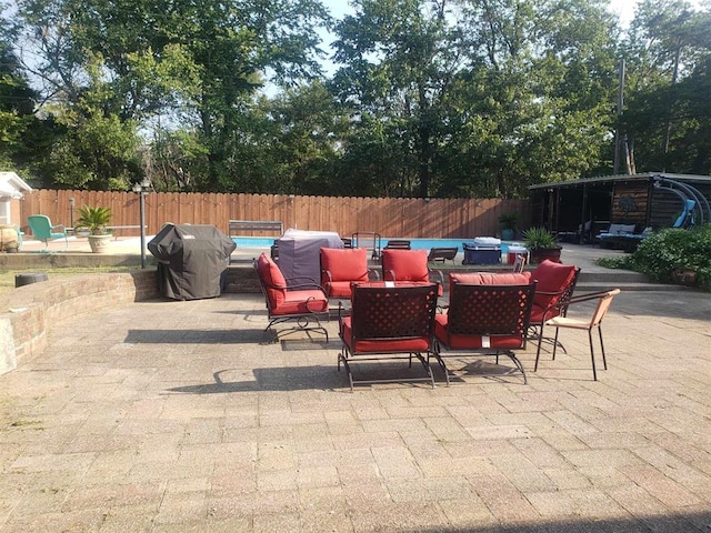 view of patio featuring a grill