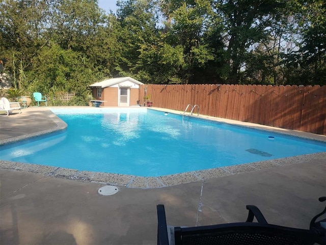 view of swimming pool featuring a patio