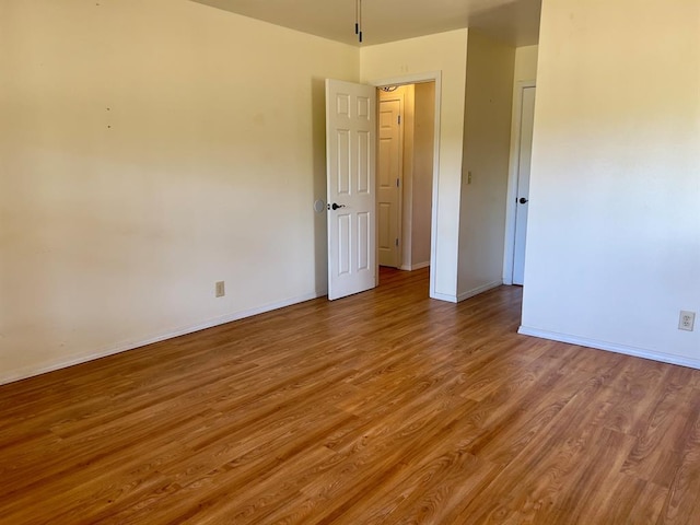 unfurnished bedroom featuring hardwood / wood-style floors