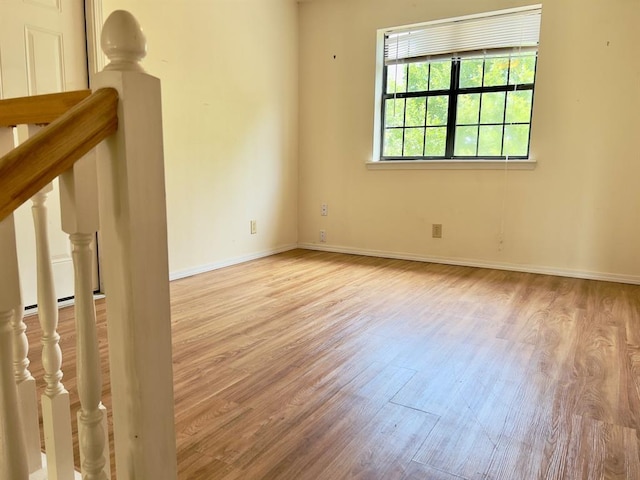 spare room featuring light hardwood / wood-style floors