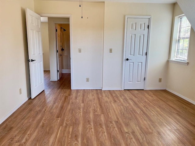 unfurnished bedroom with light hardwood / wood-style flooring