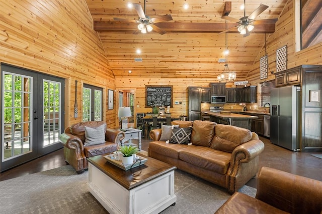 living room with wood walls, wood ceiling, high vaulted ceiling, and french doors