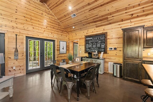 dining area featuring french doors, high vaulted ceiling, wooden walls, and wood ceiling