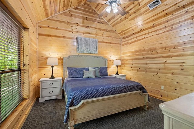 carpeted bedroom featuring wooden walls, ceiling fan, lofted ceiling, and wood ceiling