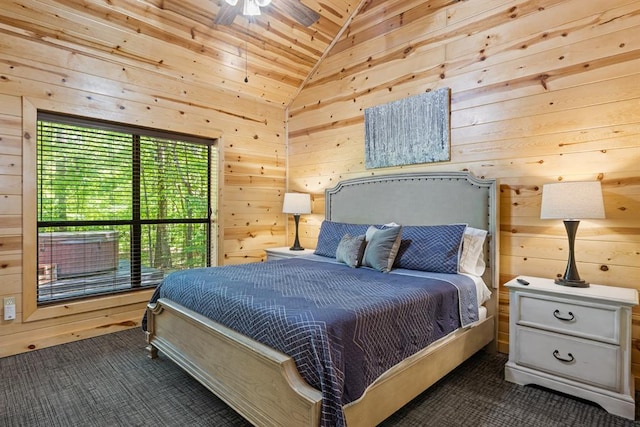 bedroom featuring ceiling fan, wood walls, lofted ceiling, and dark carpet