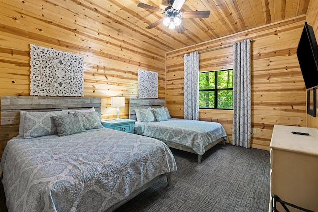 carpeted bedroom with ceiling fan, wooden ceiling, and wood walls