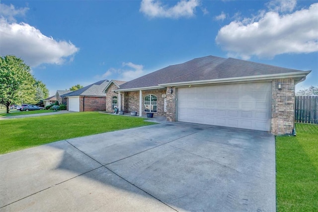 ranch-style house with a garage and a front yard