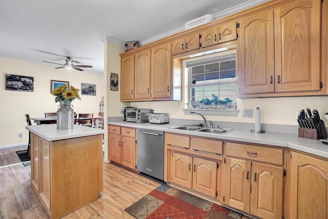 kitchen with dishwasher, a kitchen island, light hardwood / wood-style flooring, and sink